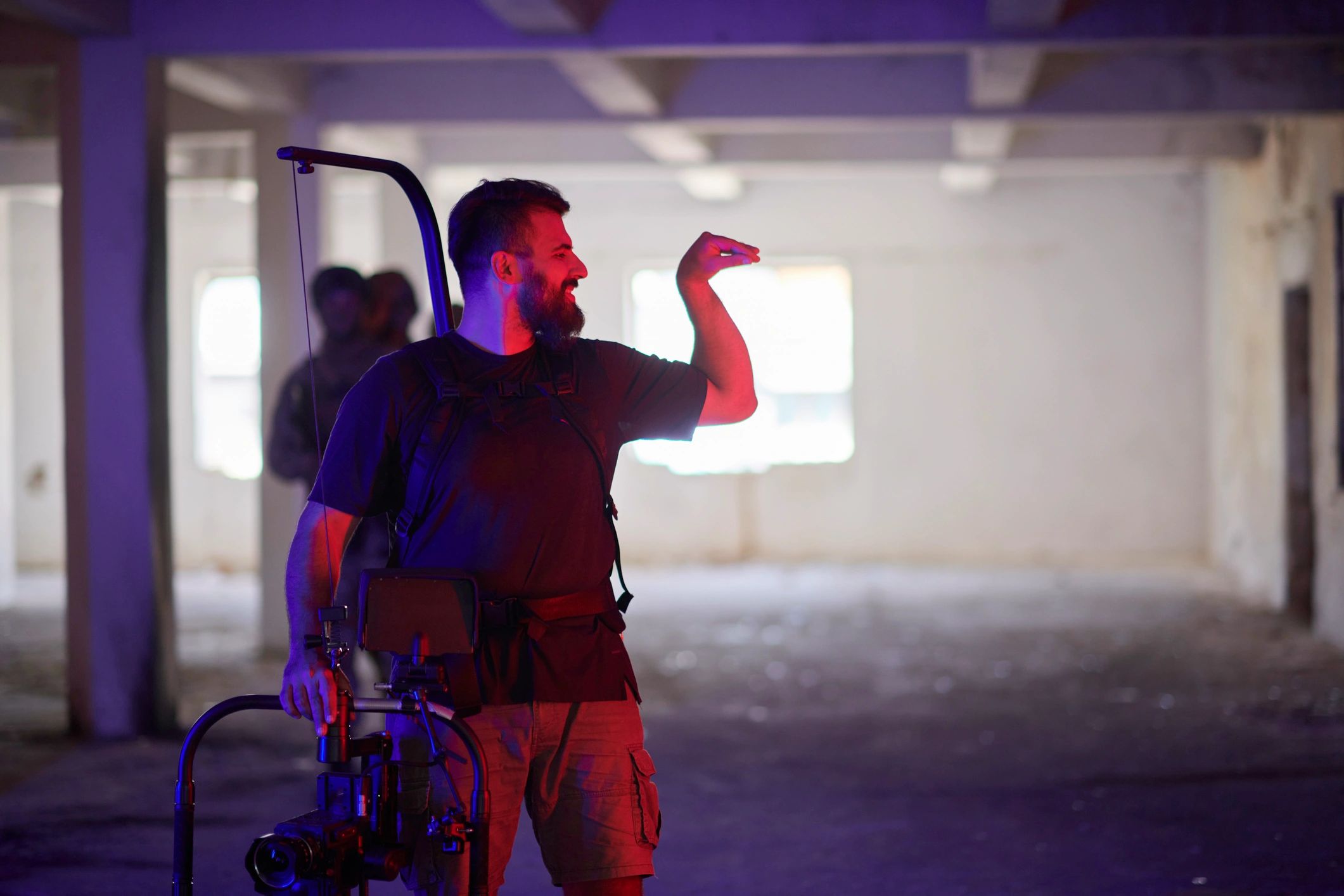 Videographer operating professional cinema camera equipment on location