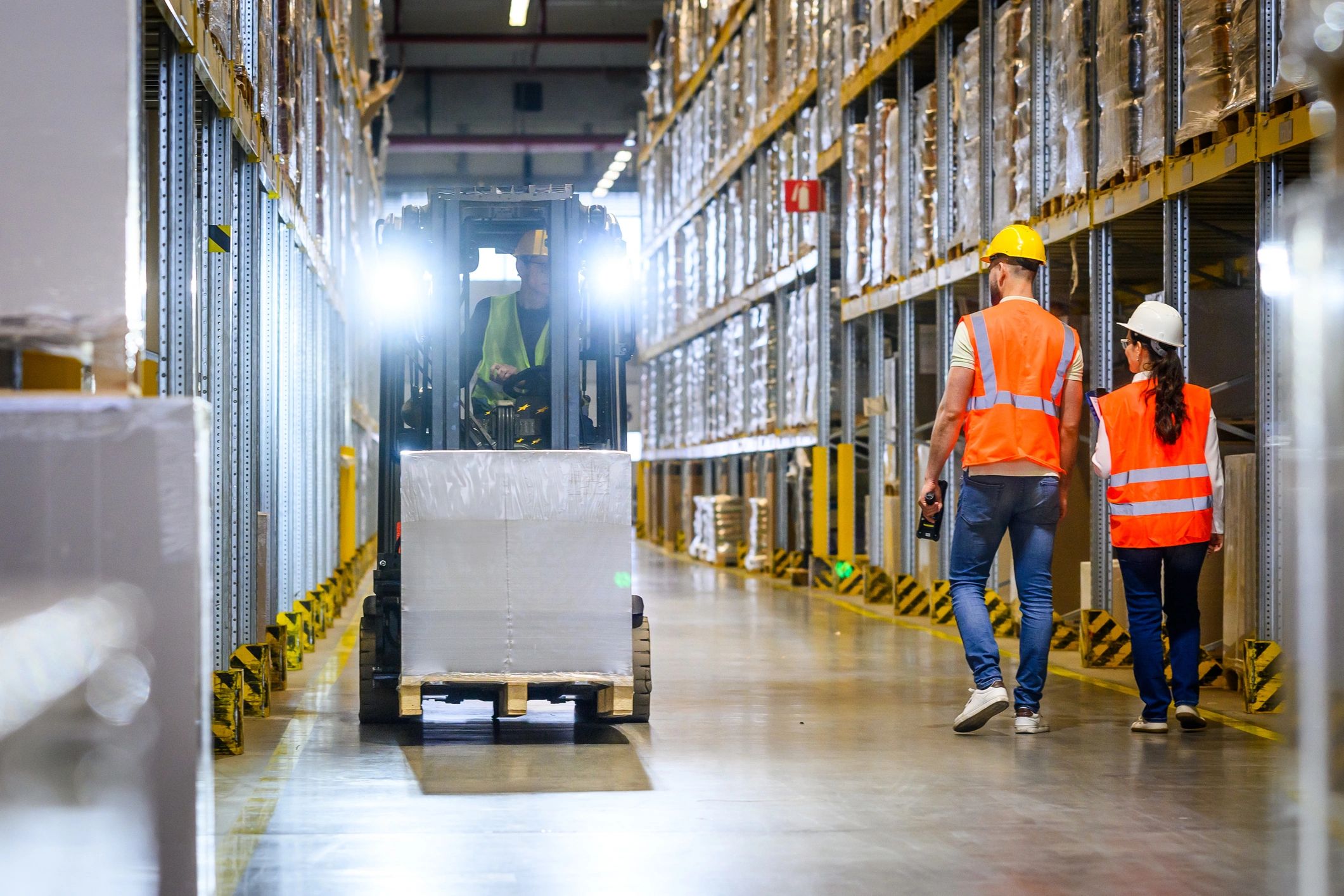 Operations team coordinating equipment logistics in a warehouse